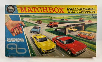 A vintage Matchbox M-2 Motorised Motorway scalextric style set. Contains 6 vehicles to include