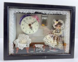 A vintage 'Little Puff' miniature bisque doll in boudoir diorama with quartz clock. Approx. 23.5cm