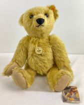 A large Steiff blonde mohair 1909 Classic bear with growler. Complete with original tags and cloth