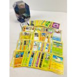 226 assorted Pokemon cards in a 2021 Pokemon V Empoleon octagonal shaped tin. Cards comprise 201