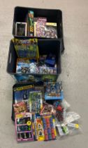 2 Star Wars plastic lidded storage tubs containing a quantity of assorted toys. To include many