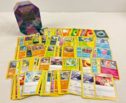 225 assorted Pokemon cards in a 2021 Pokemon V Forces Galarian Slowbro octagonal shaped tin. Cards