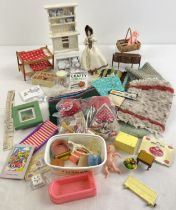 A collection of assorted vintage dolls house furniture and miniatures to include dolls, rugs,