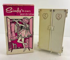 A boxed vintage Pedigree Sindy wardrobe with gold detailing to doors, together with a selection of