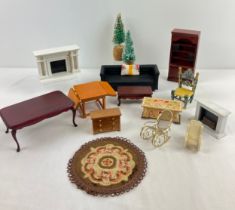 A quantity of dolls house furniture in varying scales. To include Chesterfield sofa, Christmas