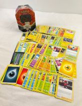 225 assorted Pokemon cards in a 2020 Pokemon V Galar Partners Cinderace V octagonal shaped tin.