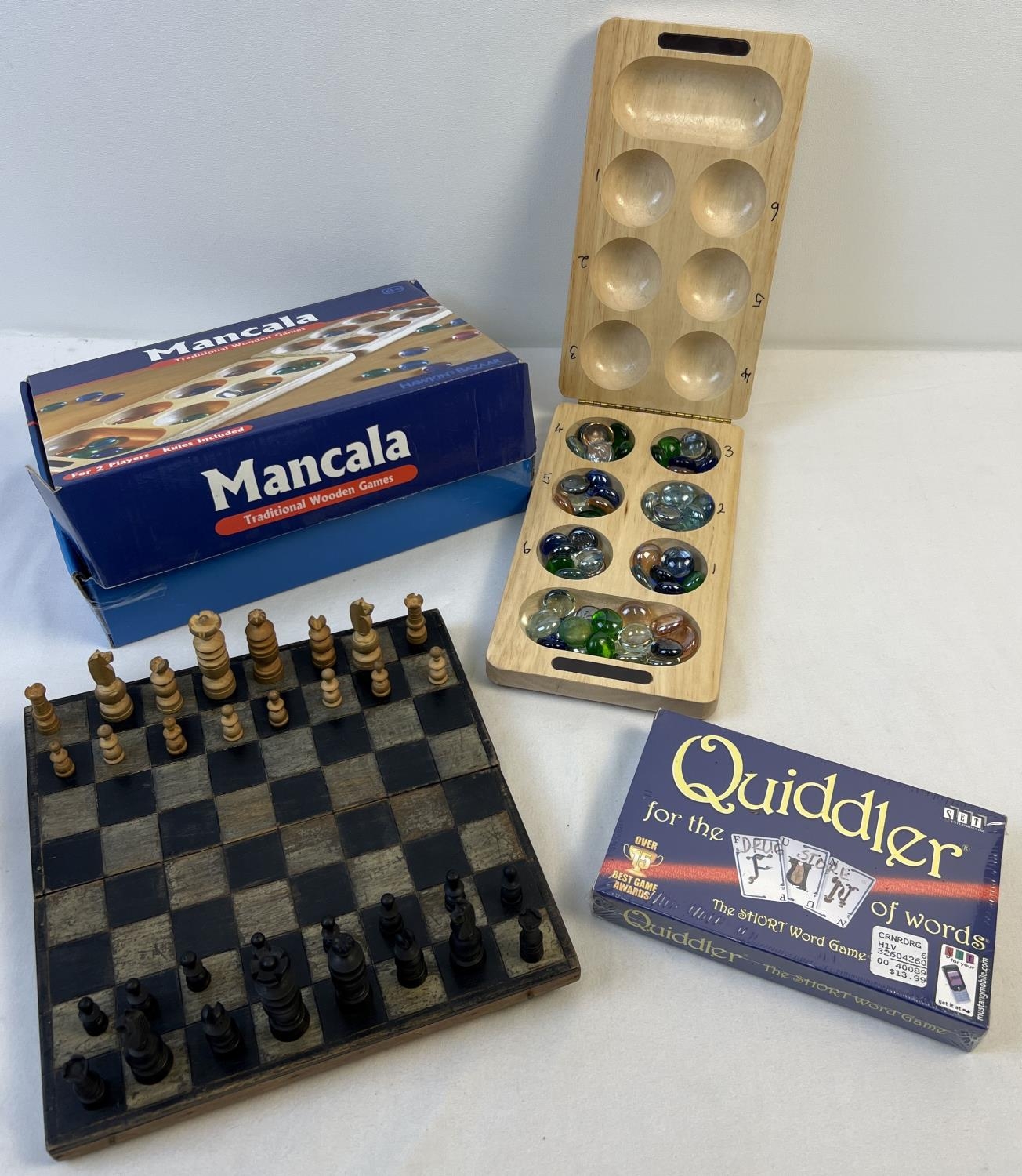 3 traditional games. Boxed Mancala game complete with glass pieces, a wooden chess set and a boxed