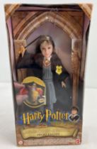 A boxed 2001 Mattel Warner Brothers Hermione 8" doll from the Harry Potter franchise. With