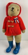 A vintage 25" Gabrielle designs Paddington bear soft toy, with red fabric duffle coat and wellington