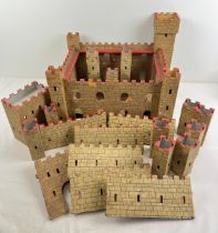 A hand built vintage c1950's wooden castle/fort with extra external wall, turrets and main gate.