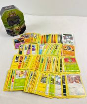 226 assorted Pokemon cards in an 2020 Pokemon from Galar Rillaboom V octagonal shaped tin. Cards