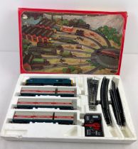 A boxed vintage Hornby Electronic Train Set R837-9130. Box contains diesel engine, 9 Freightliners