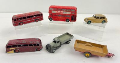 6 vintage Dinky die cast vehicles. A grey and black flatbed tipper truck, red Luxury Coach, Red