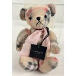 A Burberry Nova check 7" jointed teddy bear complete with original tags.