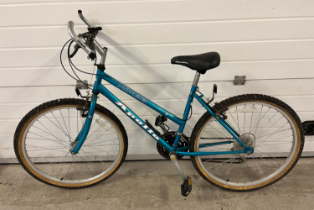 An Apollo Kimera ladies/girls mountain bike in metallic teal colour with 17" frame and 26" wheels.