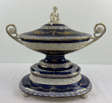 A large Continental ceramic centrepiece lidded tureen with cobalt blue banded glaze and bisque
