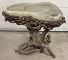 A vintage Chinese carved fluorite topped table on a gnarled tree root base. With stepped table