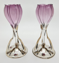 A pair of Art Nouveau silver & glass flower vases, each set with 3 garnet cabochons to base.