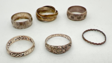 6 silver and white metal band style rings. To include Russian wedding ring, pierced work Celtic