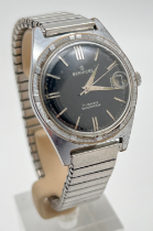 A vintage Services Super Calendar wristwatch with stainless steel case and expanding strap. Black