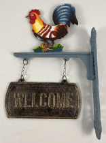 A painted cast iron wall hanging garden welcome sign with cockerel decoration. Approx. 45cm tall.