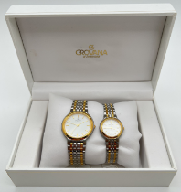 A boxed Grovana of Switzerland His & Hers watch set with stainless steel & gold tone bracelet