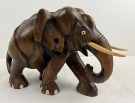 A large carved hardwood figure of an elephant. Approx. 24 x 31cm.