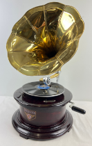 A reproduction wooden cased table top, wind up, trumpet gramophone marked "Victrola", with