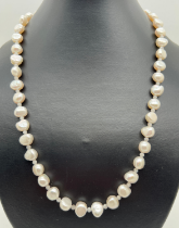 A 20" large freshwater pearl necklace with alternating white crystal beads and white metal S