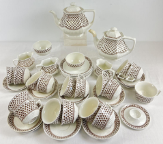A collection of ceramic Adams "Sharon" shamrock pattern teaware. Comprising: 2 teapots, 3 milk jugs,