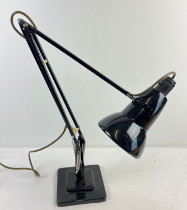 A vintage black stepped base Anglepoise lamp by Herbert Terry & Sons. Makers name to bottom of