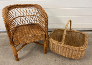 A small child's wicker chair together with a vintage wicker shopping basket.