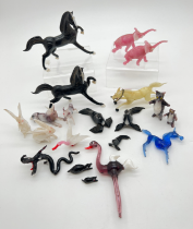 A collection of mid century coloured glass animal ornaments to include horses, elephants, cats,