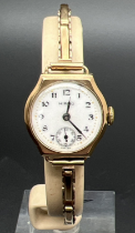 A ladies vintage 9ct gold cocktail watch with expanding bracelet strap, by Hirco. White enamelled