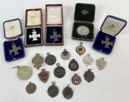 20 vintage boxed and unboxed sports medals and medallions. To include swimming, running, football