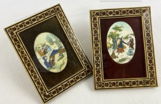 A pair of Persian miniature hand painted scenes on oval disc panels, in decorative inlaid frames.