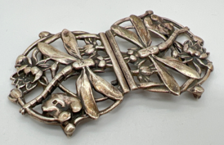 A vintage silver Art Nouveau style pierced work buckle with dragonfly and floral detail. Hallmarks