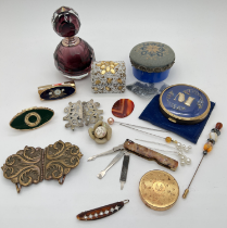 A box of mixed vintage vanity items and trinket boxes. To include purple glass perfume bottle,
