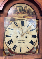 An antique fruit wood long case clock by John Jones Aberystwyth, Wales. Hand painted face with