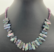 A 16" freshwater peacock keshi pearl and purple coloured crystal necklace with S shaped white