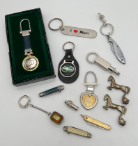 A small collection of vintage keyrings and penknives. To include Land Rover and gold tone cased
