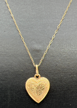 A 9ct gold heart pendant with floral design front and back. On an 18" fine 9ct gold belcher chain