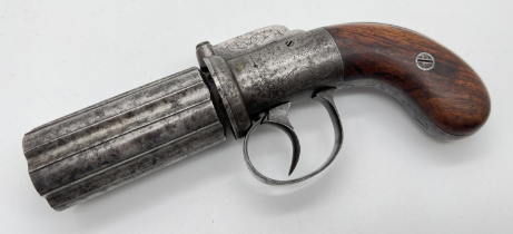 An antique Durs Egg, London 6 barrel pepperbox percussion pistol with wooden grip. Engraved detail