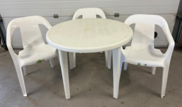 A white plastic circular garden table and 3 Keter chairs. Chairs stack and table legs are