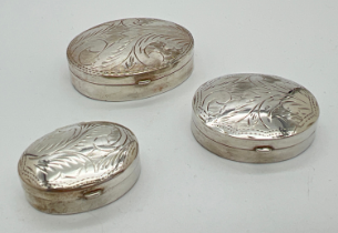 3 modern 925 silver oval shaped trinket boxes with engraved scroll & foliate design to lids. Each