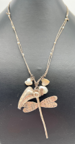 A modern white metal dragonfly pendant necklace with heart shaped & natural freshwater pearl
