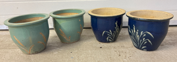 2 pairs of glazed garden pots with foliate design. Each approx. 22cm tall x 26cm diameter.