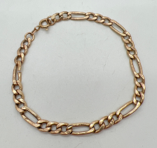 A 9ct gold 7.5 inch Figaro chain bracelet with spring clasp for scrap or repair. One link cut