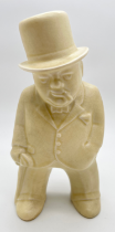 A 1940's Bovey Pottery ceramic figurine of Winston Churchill, from the 'Our Gang' series. In cream