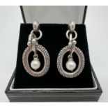 A pair of silver, 14ct gold and pearl drop earrings by Michael Dawkins. Round white single pearl